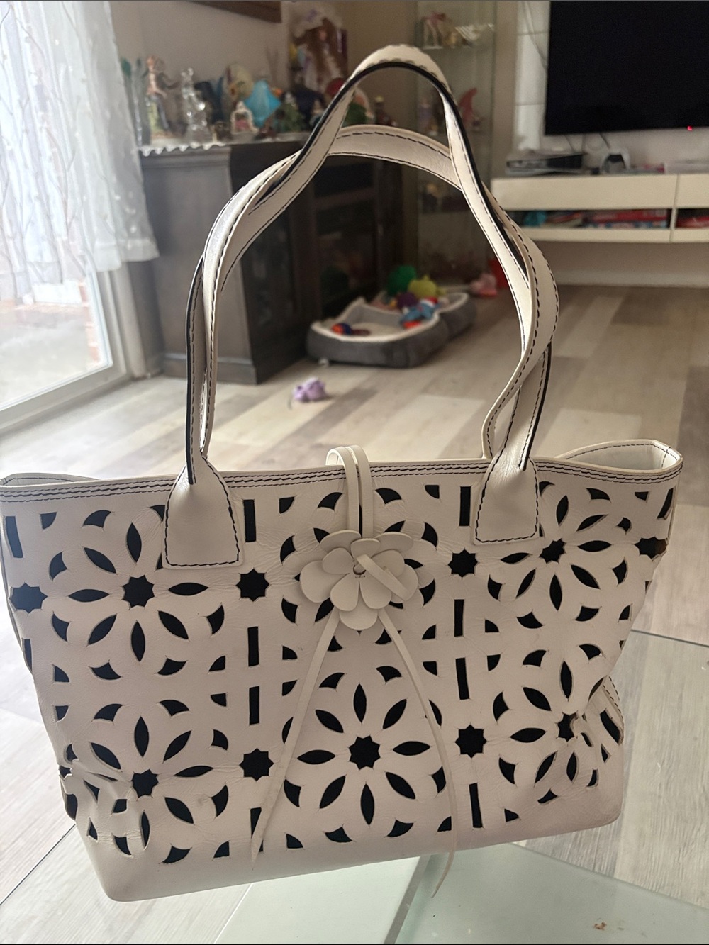 Leather bag embossed with flowers.
